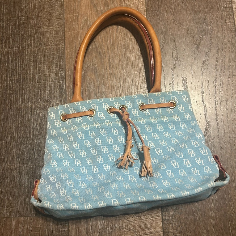 Dooney and Bourke blue canvas purse with leather accents